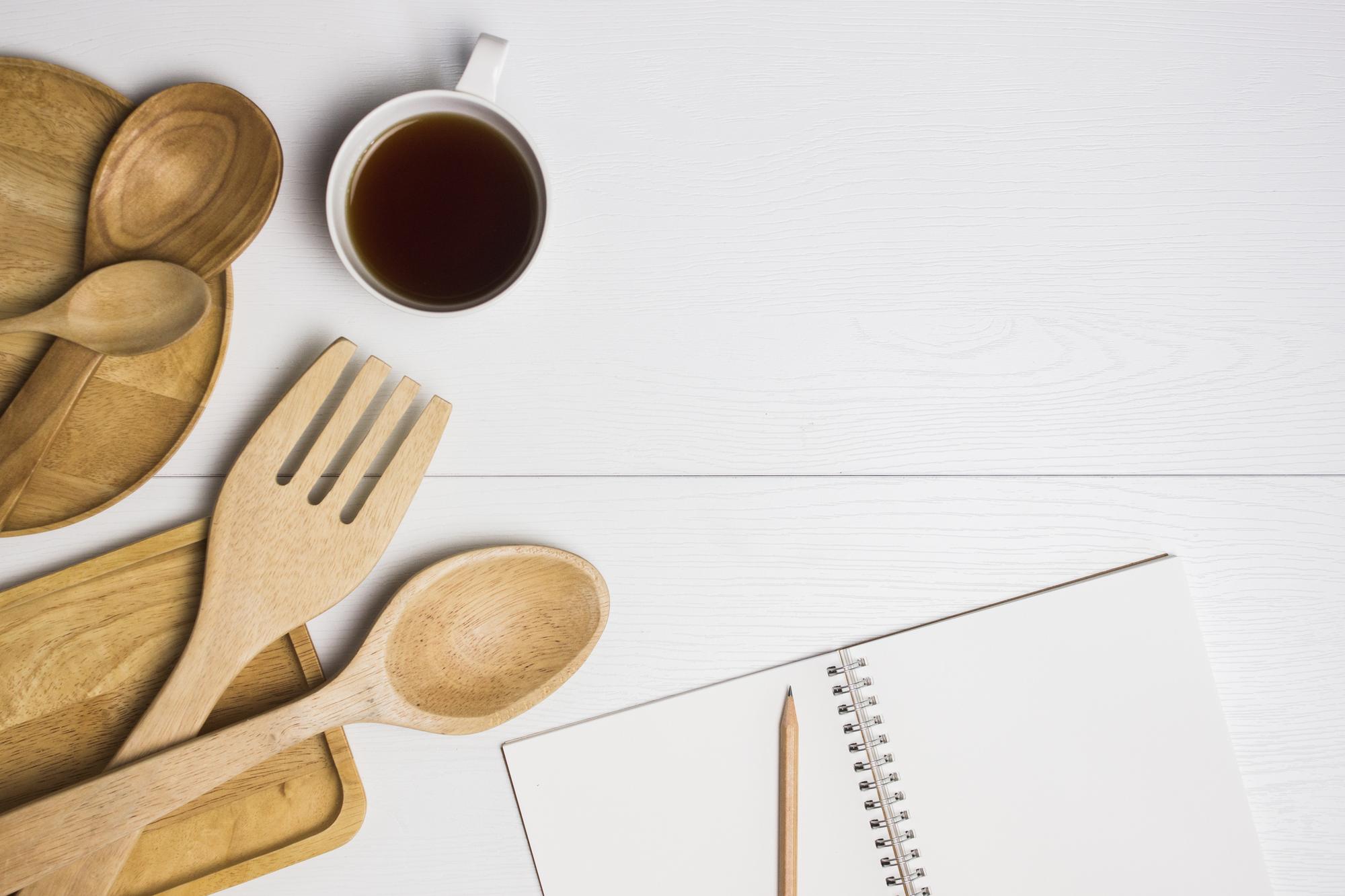 Workshop table with notebooks and tasting spoons