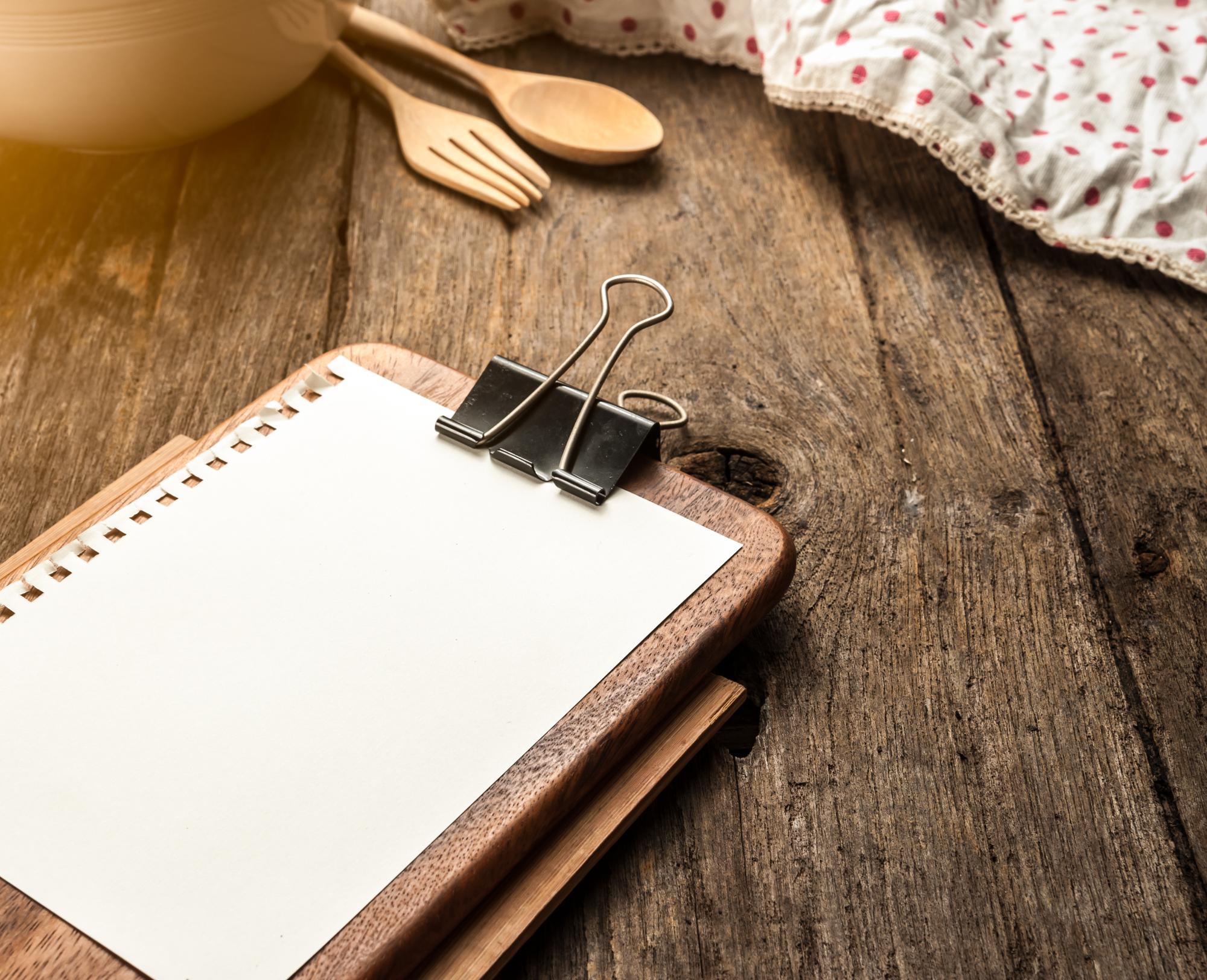 Stacked notebooks and recipe cards